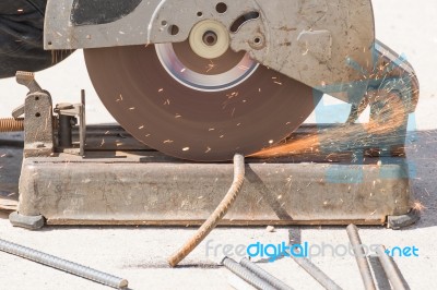Worker Cutting Metal With Grinder Stock Photo