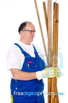 Worker Holding Boards Stock Photo