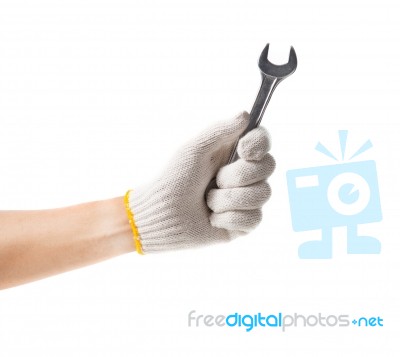 Working Hand In Glove Holding Wrench Stock Photo