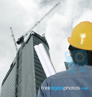 Workman At Construction Site Stock Photo
