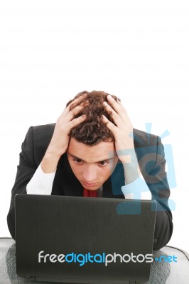Worried Businessman With Pc Stock Photo