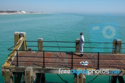 Worthing, West Sussex/uk - April 20 : Fishing From Worthing Pier… Stock Photo