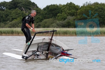 Yachtsman Attempting To Right His Dinghy On Hickling Broad Stock Photo