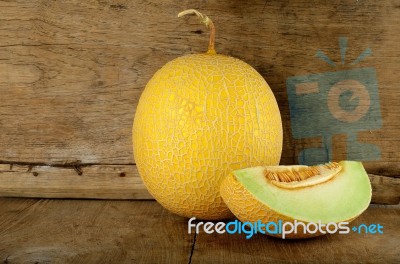 Yellow Cantaloupe Melon On The Wooden Background Stock Photo