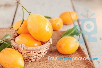 Yellow Fruit On Wooden Stock Photo