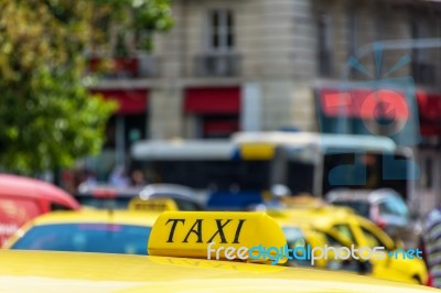 Yellow Taxi Sign On Cab Vehicle Roof Stock Photo