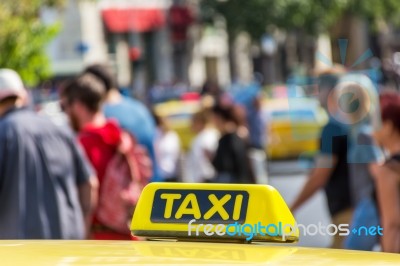 Yellow Taxi Sign On Cab Vehicle Roof Stock Photo