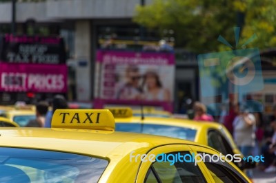 Yellow Taxi Sign On Cab Vehicle Roof Stock Photo