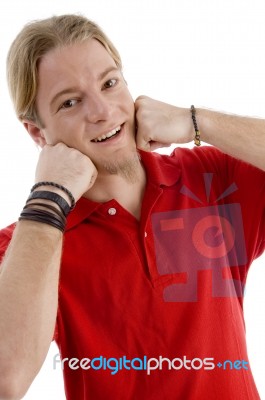 Young American Male Posing With His Hands On Chin Stock Photo