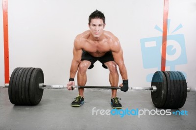 Young And Muscular Guy Holding A Barbell.  Crossfit Dead Lift Ex… Stock Photo