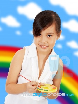 Young Artistic Girl With A Paint Set Stock Photo