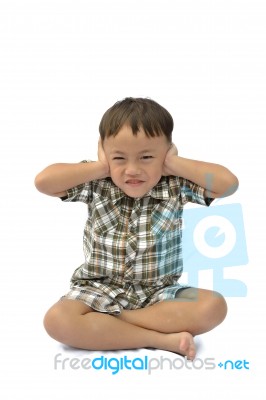 Young Asian Boy Closing Ears Stock Photo