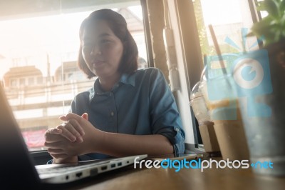 Young Asian Woman Working In Coffee Shop Stock Photo