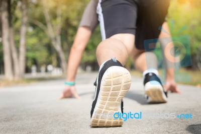 Young Athletes At Starting Position Ready To Start A Race. Sprin… Stock Photo