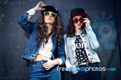 Young Beautiful Girls With Denim Suit In A Urban Background Stock Photo