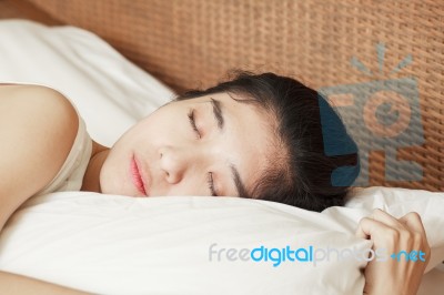 Young Beautiful Woman Sleeping In Bed Stock Photo