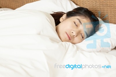 Young Beautiful Woman Sleeping In Bed Stock Photo