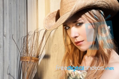 Young Blonde Female In Western Hat Stock Photo