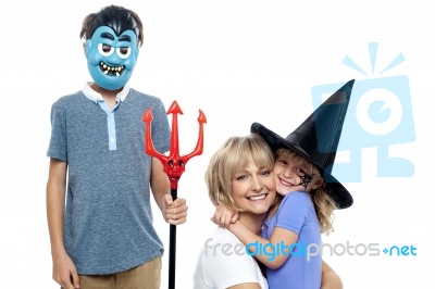 Young Boy And Cute Girl Participating In Halloween Celebration Stock Photo