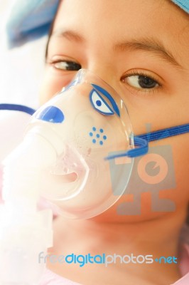 Young Boy And Hospital Instrument On His Face Stock Photo