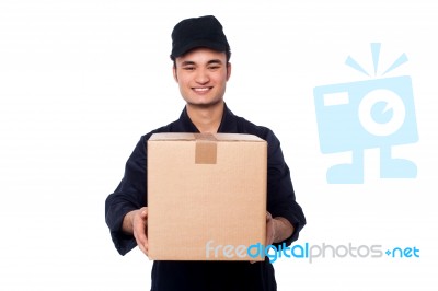 Young Boy Delivering Parcel Safely Stock Photo