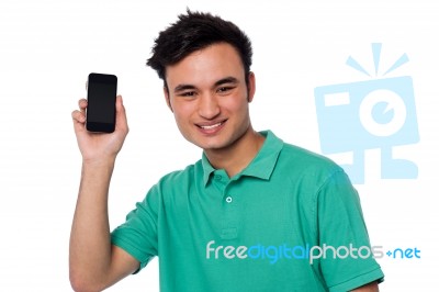 Young Boy Displaying Brand New Cellphone Stock Photo