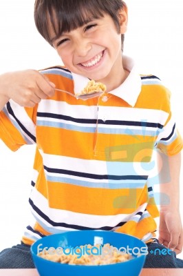 Young Boy Eating His Breakfast Stock Photo