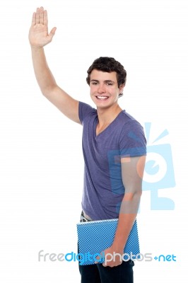 Young Boy Holding Notebook Stock Photo