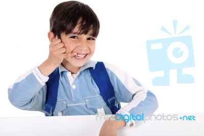 Young Boy Pretends To Talk On Phone Stock Photo