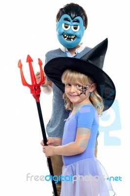 Young Brother And Sister In Halloween Costume Stock Photo