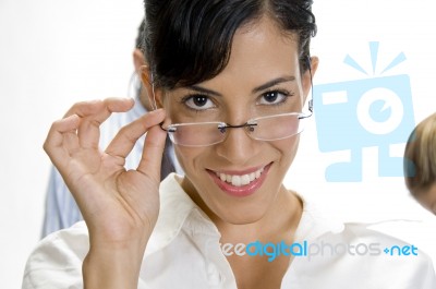 Young Brunette Woman Posing With Her Eyewear Stock Photo