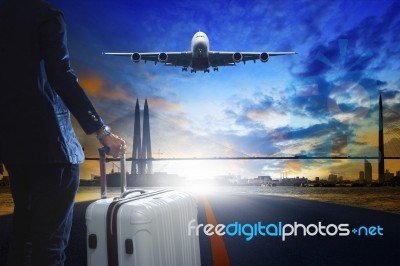 Young Business Man Standing With Luggage On Urban Airport Runway… Stock Photo