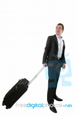 Young Business Man Walking On White Background With His Trolley Stock Photo