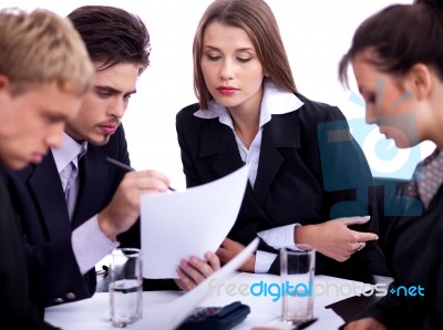 Young Business Professionals Discussing Seriously Stock Photo