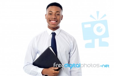 Young Businessman Holding Business File Stock Photo