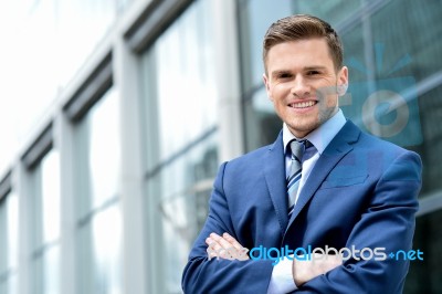 Young Businessman Smiling In A Office Outdoor Stock Photo
