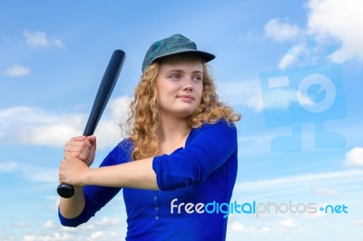 Young Caucasian Woman With Baseball Bat And Cap Stock Photo