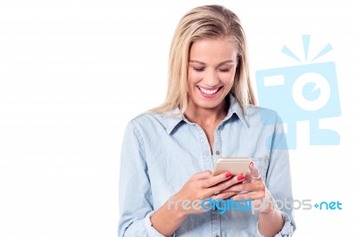 Young Charismatic Woman Using Smartphone Stock Photo
