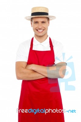 Young Chef Wearing Straw Hat Stock Photo