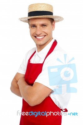 Young Chef Wearing Straw Hat Stock Photo