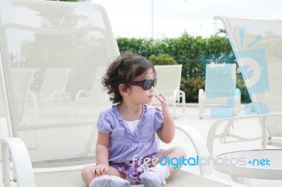 Young Child Wearing Sunglasses Stock Photo