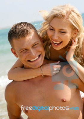 Young Couple At Beach Stock Photo