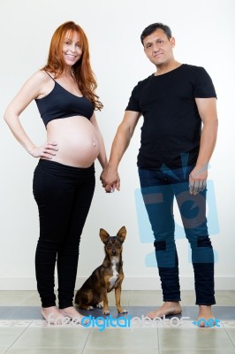 Young Couple Expecting Baby. Isolated On White Stock Photo