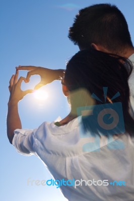 Young Couple Having Fun In A Park Stock Photo