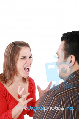 Young Couple In Conflict Shouting Isolated On White Background Stock Photo