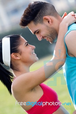Young Couple In The Park After Exercise Stock Photo