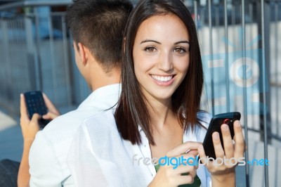 Young Couple With Smart Phone Stock Photo
