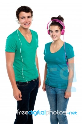 Young Couples Enjoying Music Stock Photo