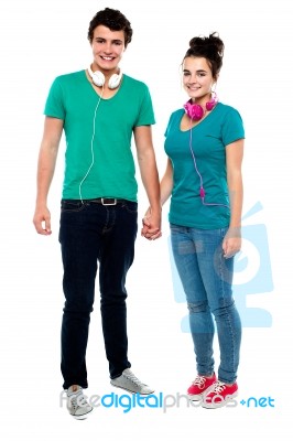 Young Couples Enjoying Music Stock Photo
