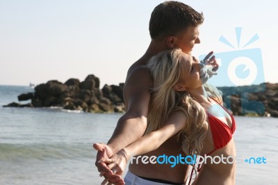 Young Couples Fun At Beach Stock Photo